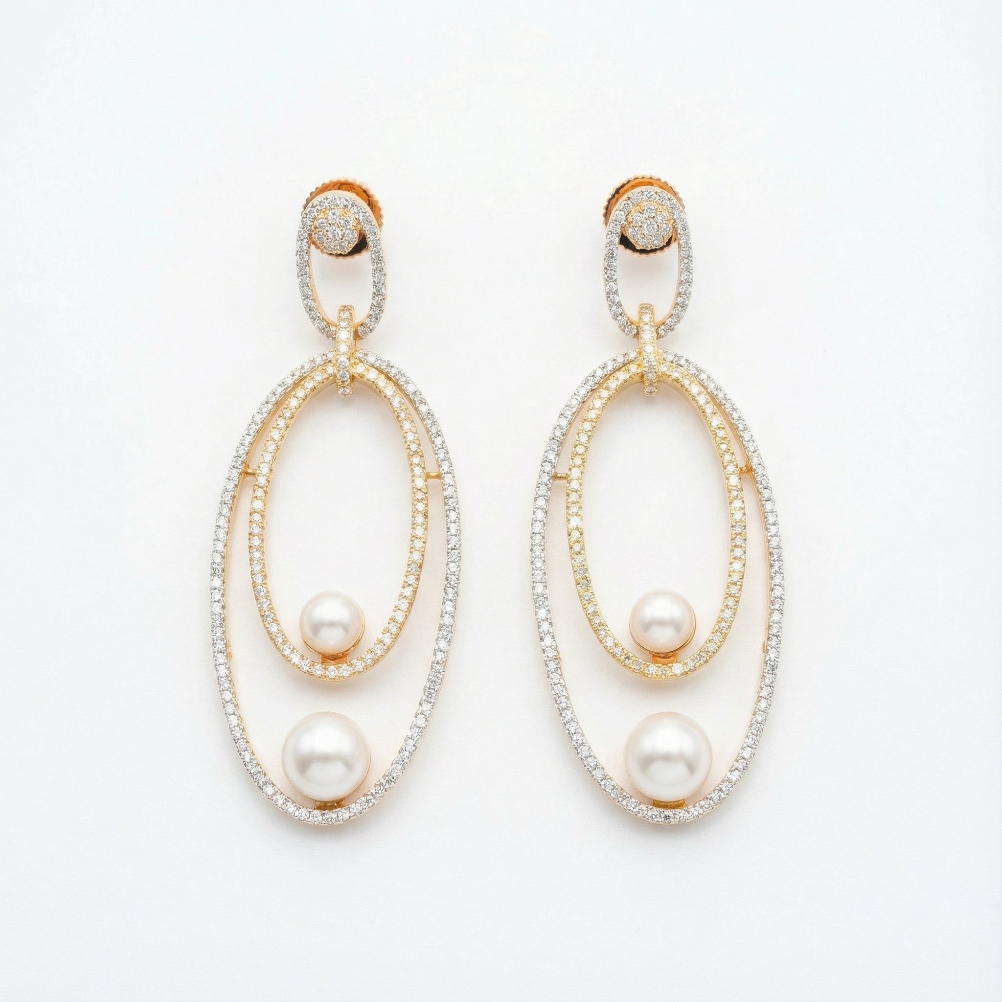 Orbitline Drop Earrings two-tone nested oval drops with pavé crystals and pearls on white background