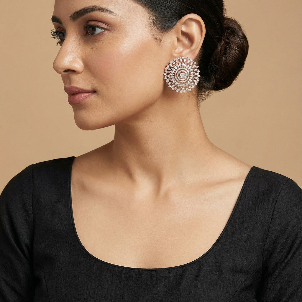 Helia Crystal Bloom Stud Earrings detail showing marquise ray tiers and pavé halos