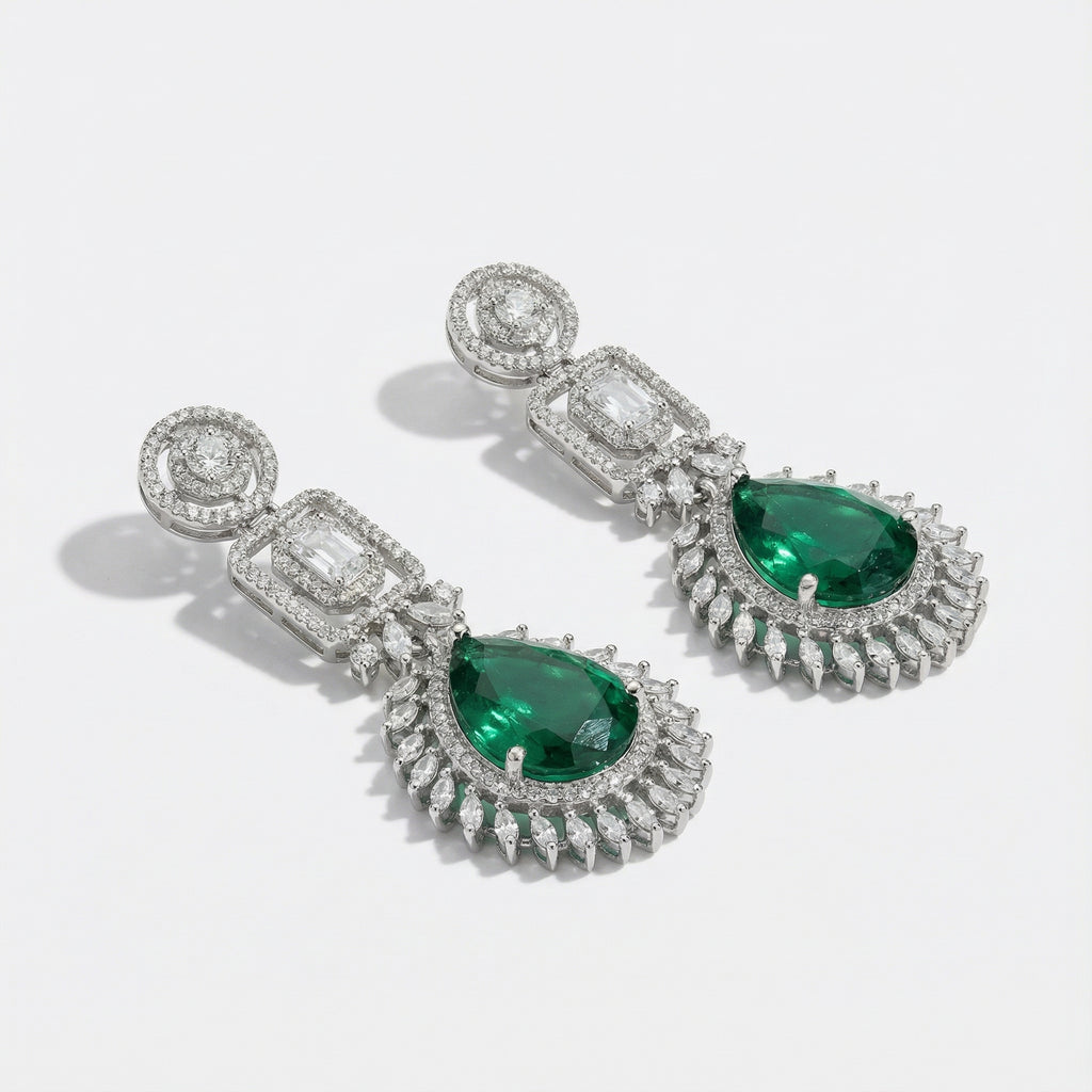 Elowen Emerald Descent Earrings detail showing sunburst marquise border and green teardrop