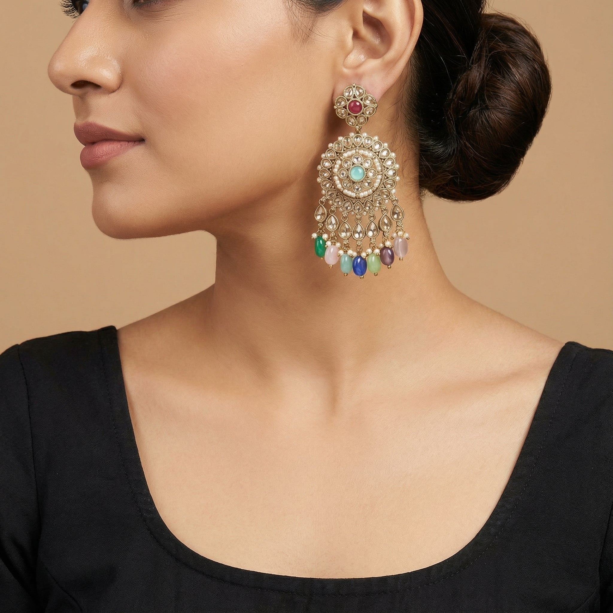 Navya Festival Earrings detail showing ruby polki stud, pearl-bordered medallion, and colorful bead dangles