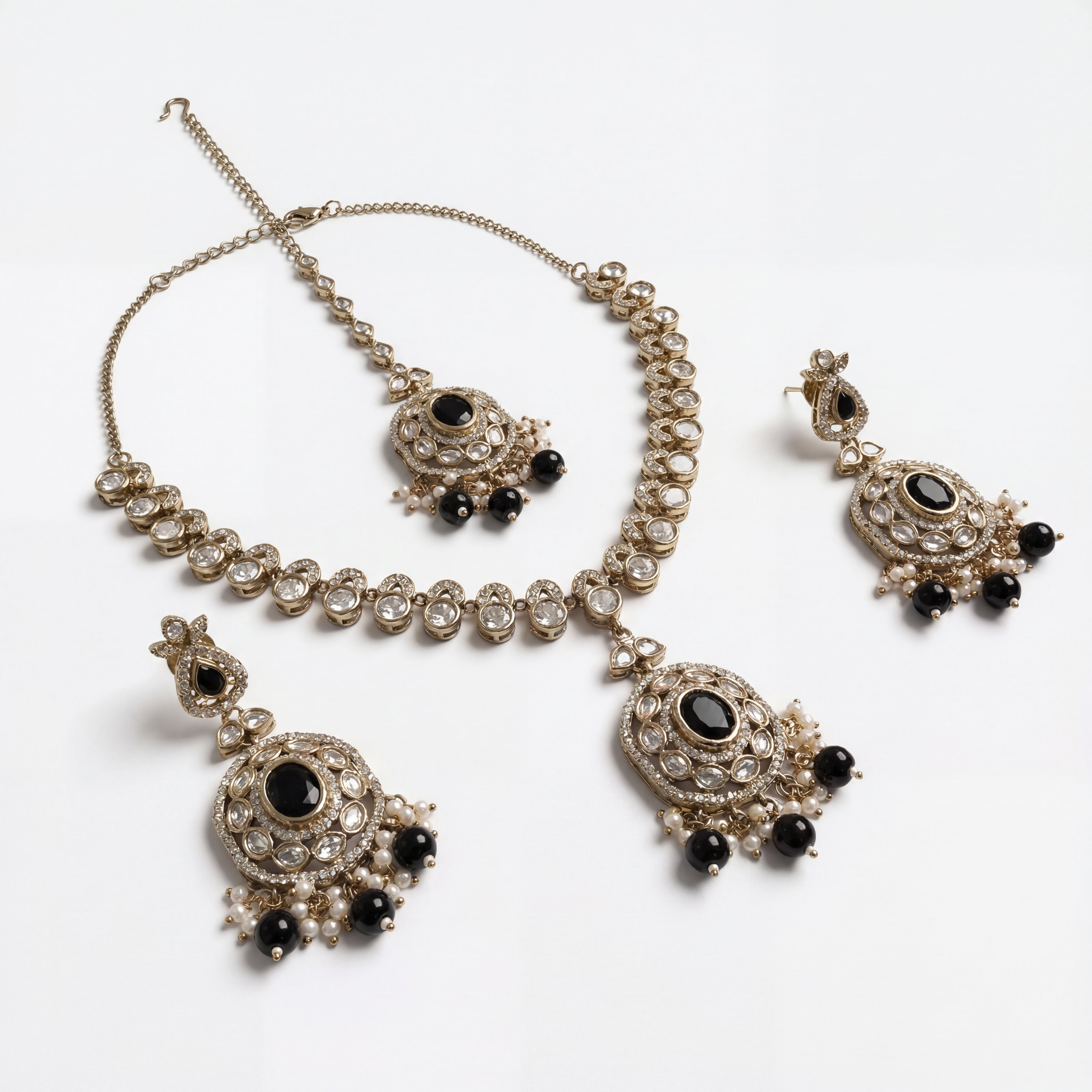Eclipse Polki Necklace Set detail showing black oval center stones and pearl-and-bead fringe