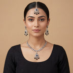 Eclipse Polki Necklace Set detail showing black oval center stones and pearl-and-bead fringe