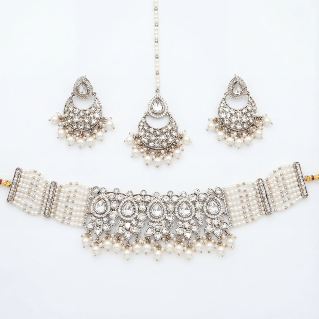 Saaya Pearl Choker Necklace Set silver choker with pearl strands, chandbali earrings, and maang tikka on white background