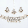 Saaya Pearl Choker Necklace Set silver choker with pearl strands, chandbali earrings, and maang tikka on white background