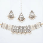 Saaya Pearl Choker Necklace Set silver choker with pearl strands, chandbali earrings, and maang tikka on white background