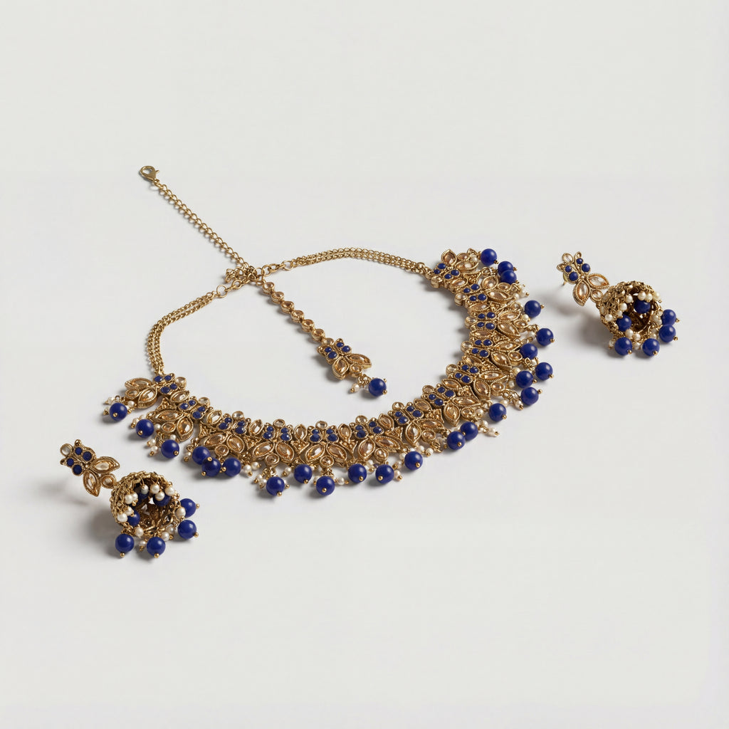 Sitara Blue Cascade Necklace Set gold choker with blue beads and matching jhumka earrings and tikka