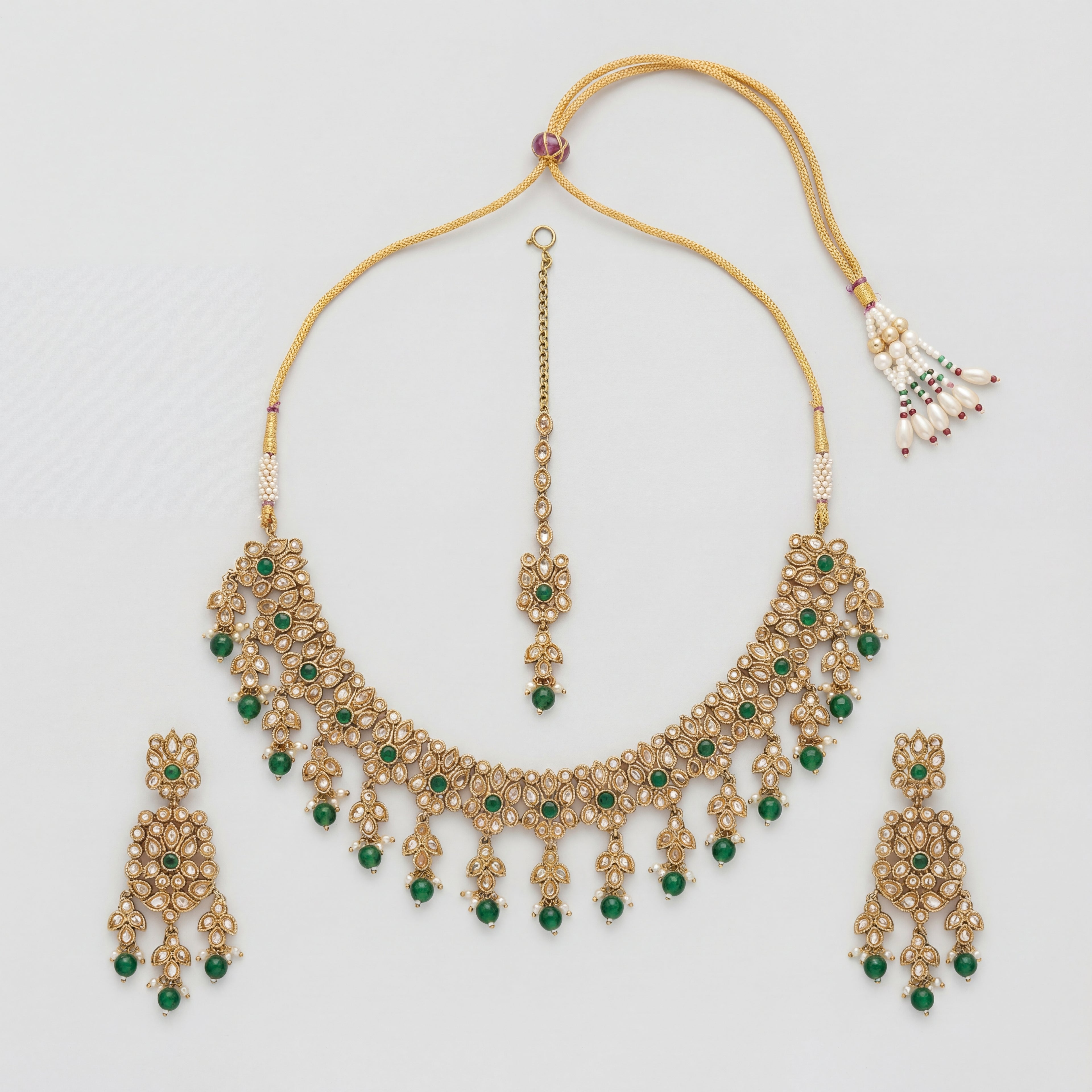 Utsav Emerald Polki Necklace Set gold choker with green beads, earrings, and tikka