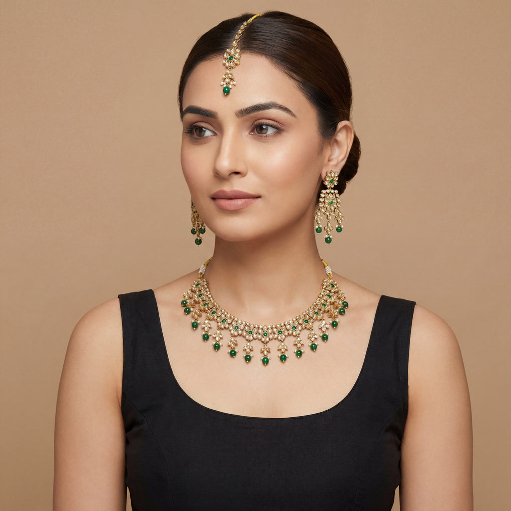 Utsav Emerald Polki Necklace Set detail of emerald polki motifs and green latkan fringe