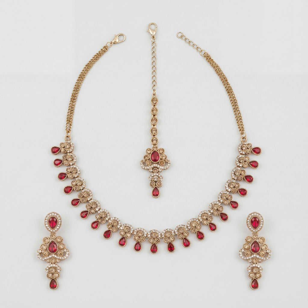 Zeenat Ruby Polki Necklace Set gold bib necklace with ruby fringe, earrings, and maang tikka on white background