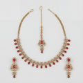 Zeenat Ruby Polki Necklace Set gold bib necklace with ruby fringe, earrings, and maang tikka on white background