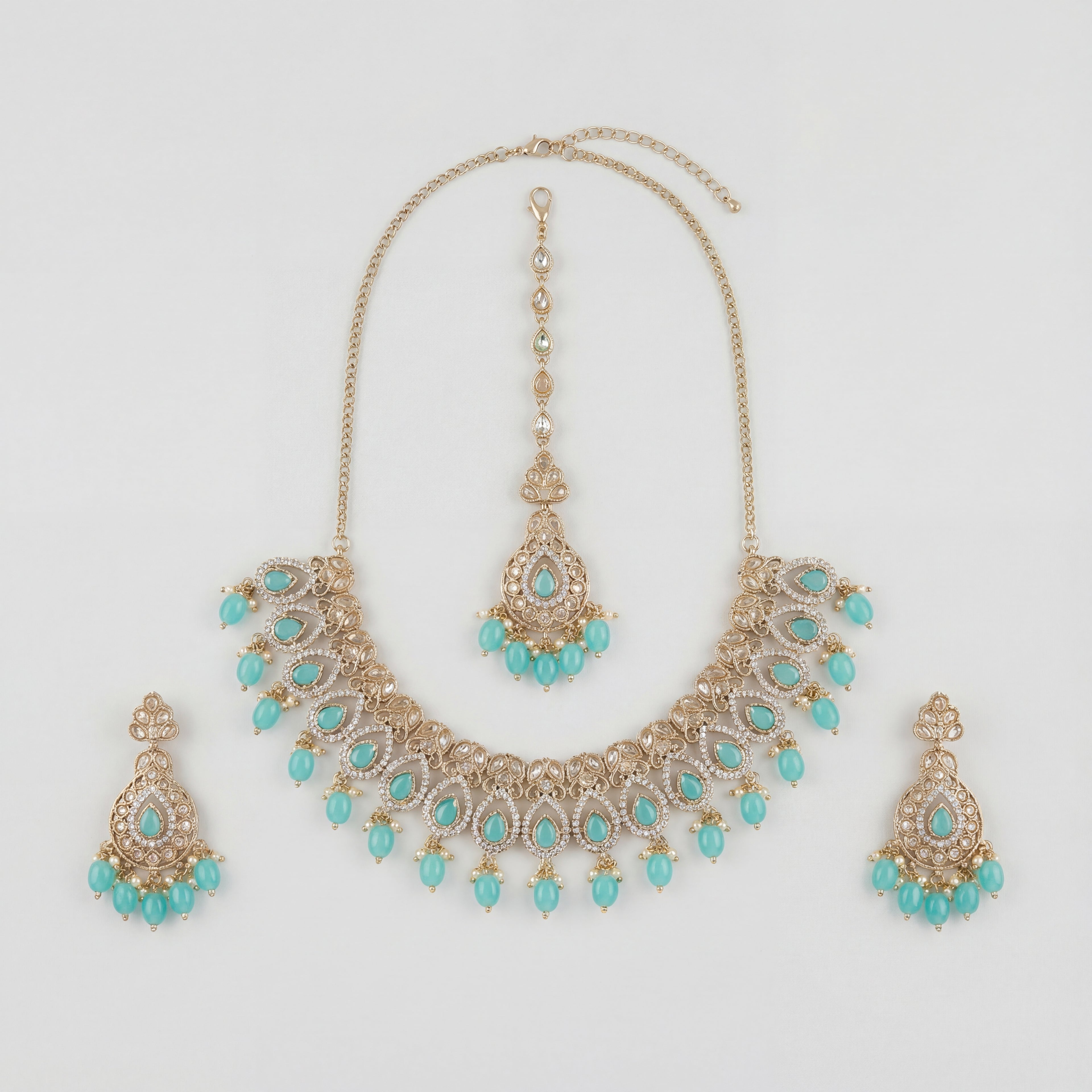 Chandni Aqua Polki Necklace Set with turquoise teardrop stones, earrings, and maang tikka