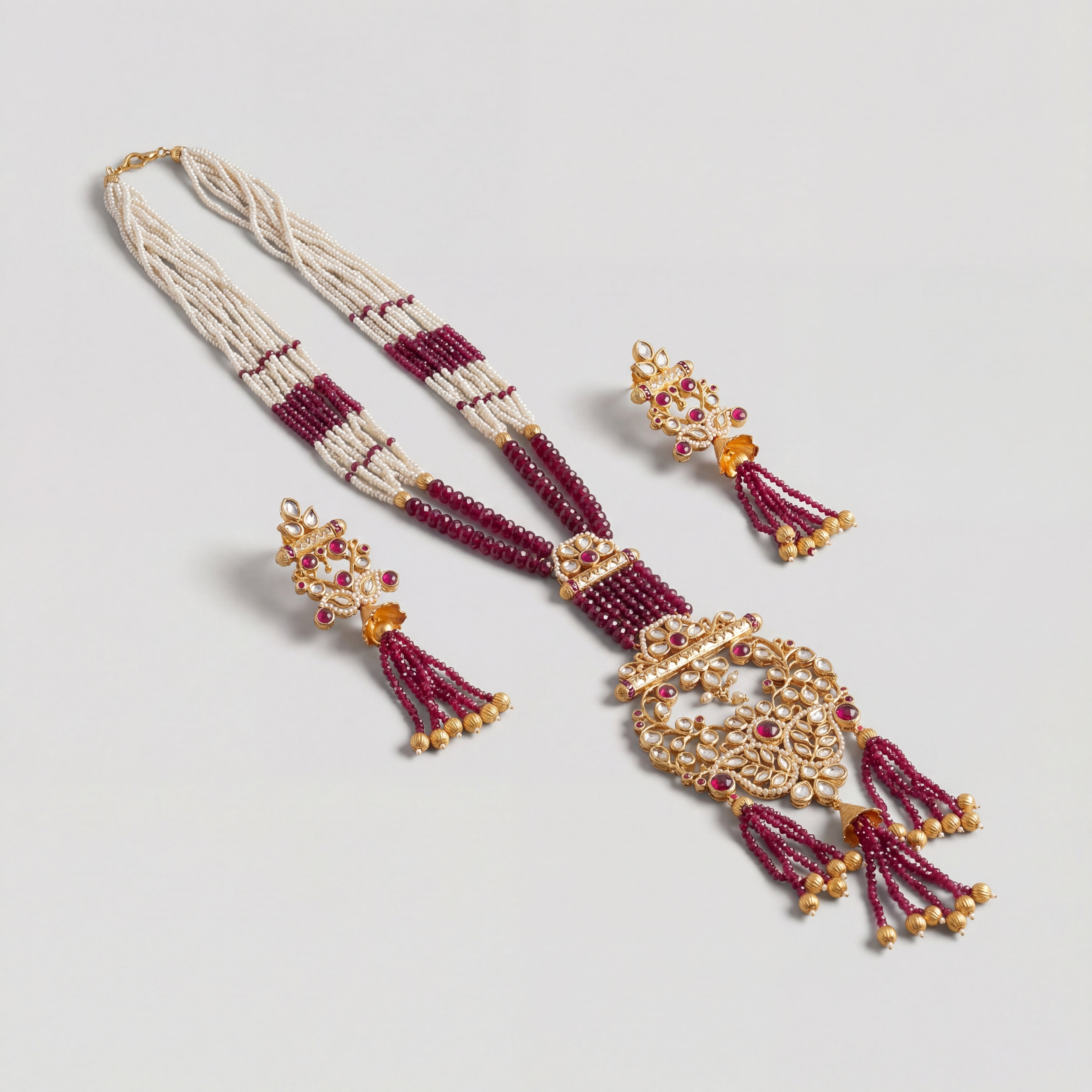 Shahi Ruby Polki Grand Necklace Set detail showing pearl and ruby strands and pendant tassels