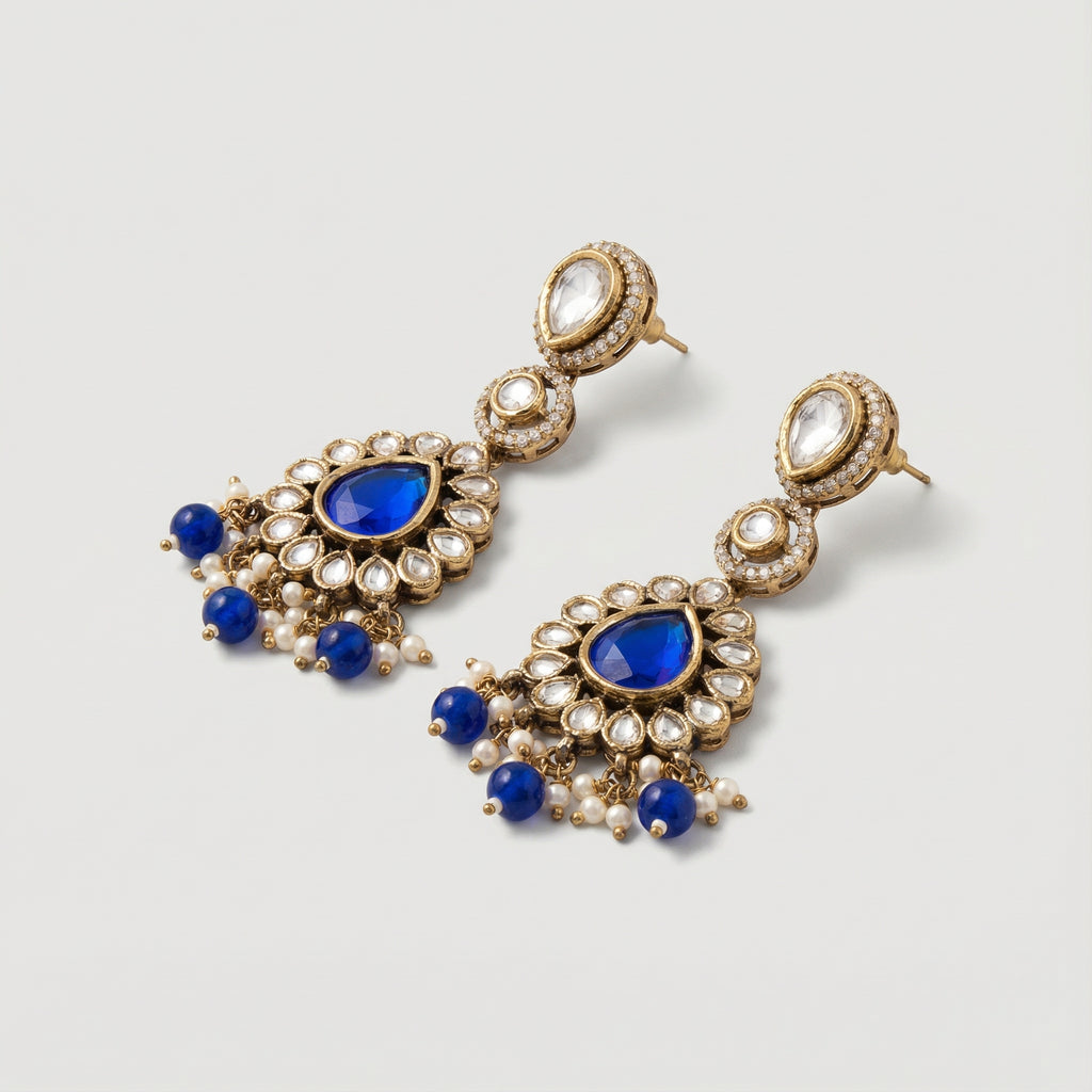 Close-up of Royal Neelam Pearl Earrings showing pearl accents and gold-plated finish