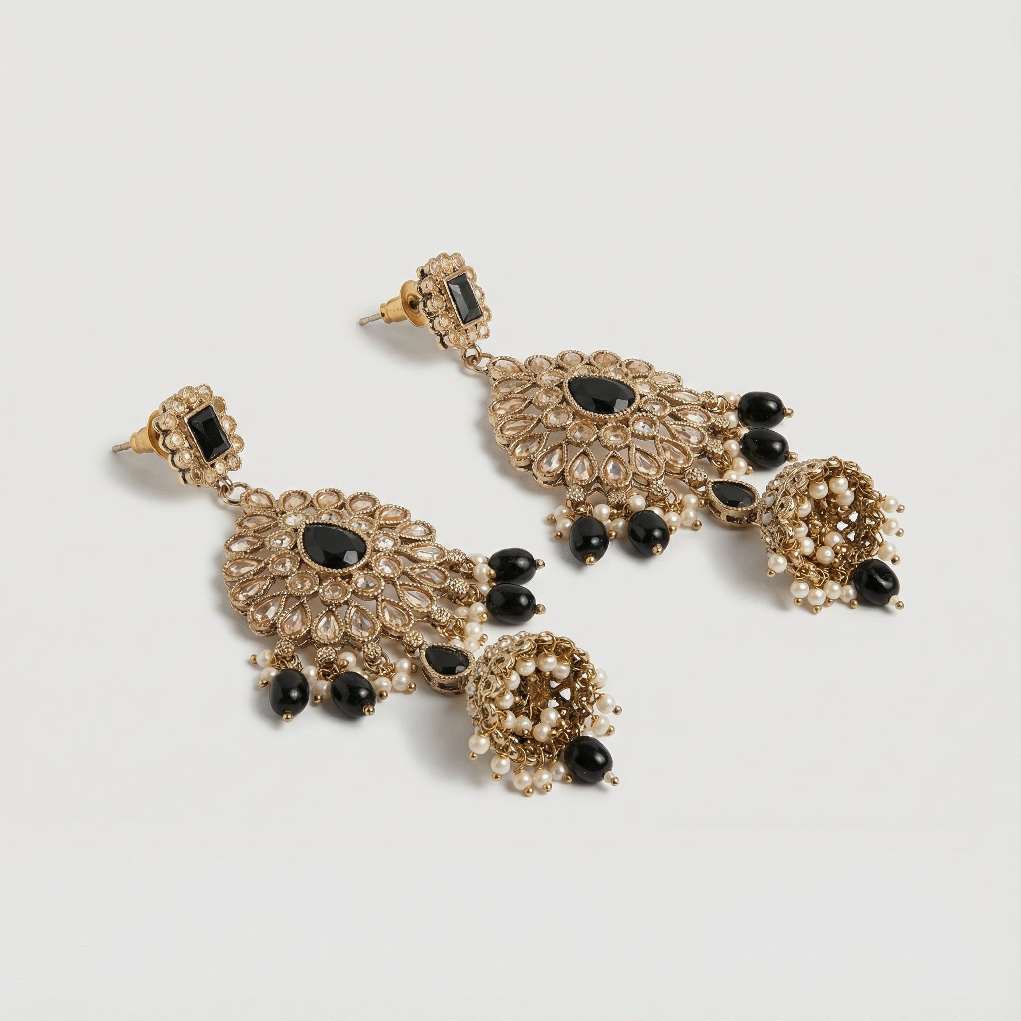 Onyx Noor Jhumka Earrings detail showing filigree sunburst panel and pearl-lined bell