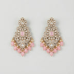 Pink Noor Kundan Earrings gold-tone chandelier drops with pink cabochon centers and pearl fringe on gray background