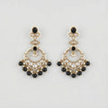 Onyx Circle Noor Earrings gold chandbali hoops with black onyx and pearl fringe on gray background