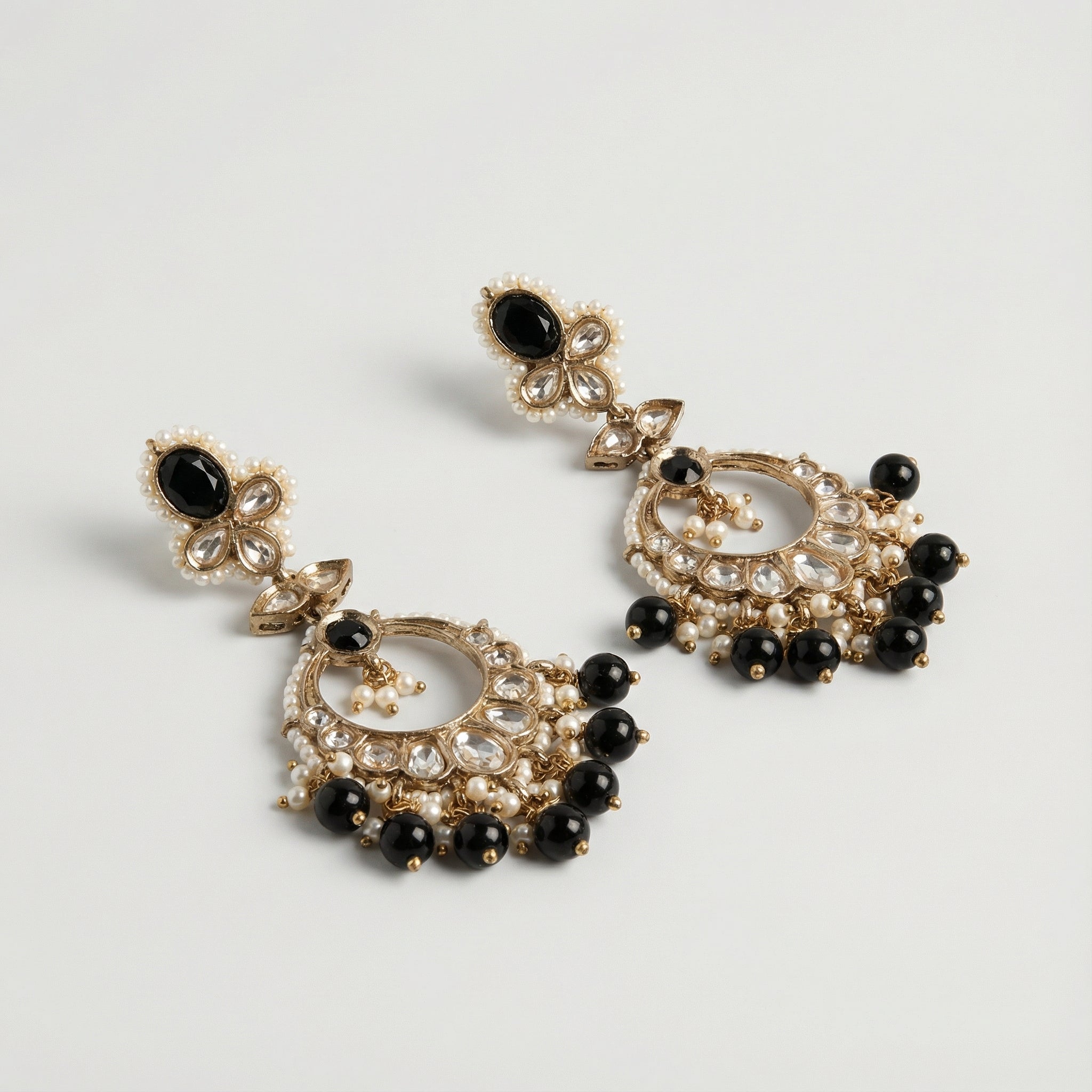 Onyx Circle Noor Earrings detail showing onyx floral stud, kundan teardrop fan, and black bead dangles