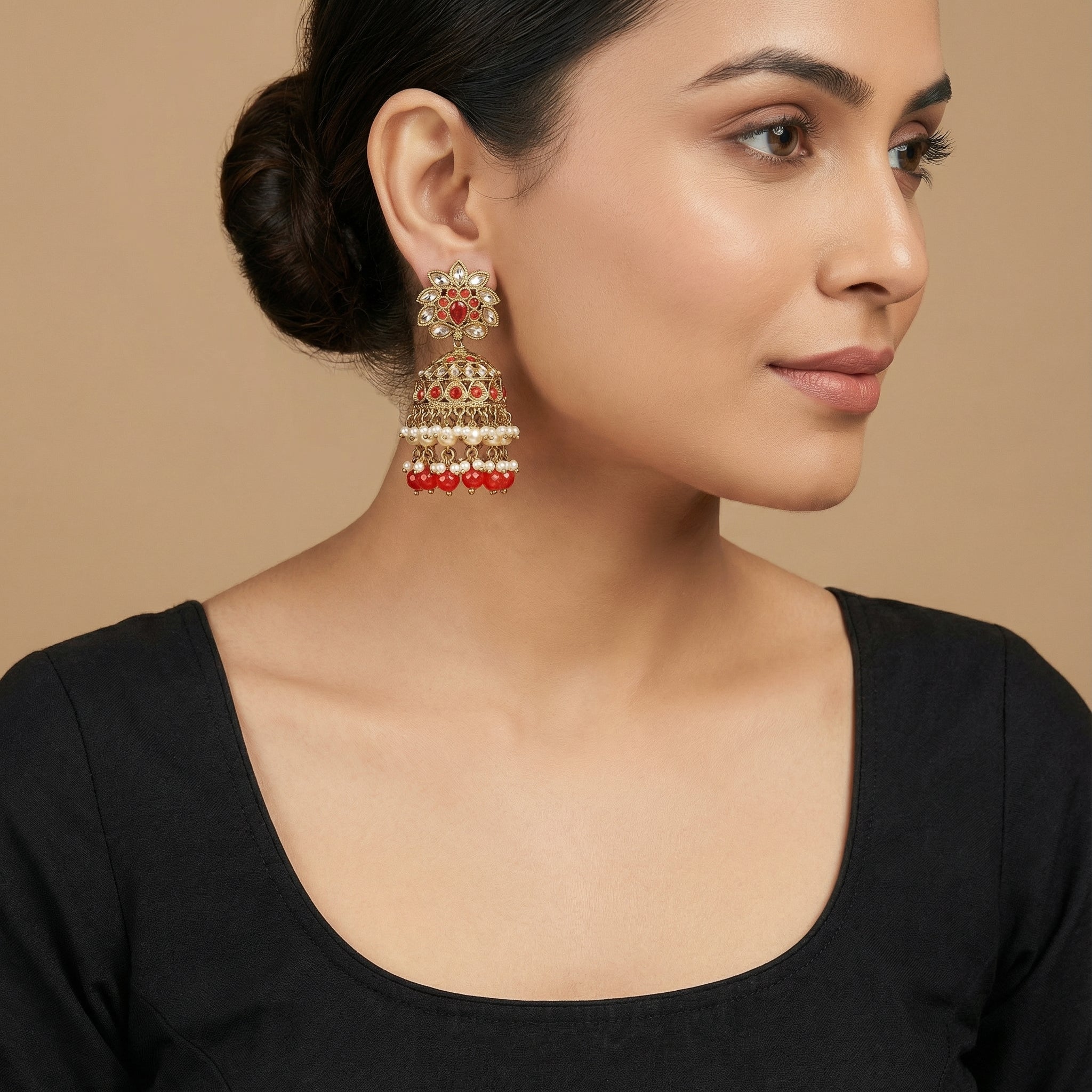 Crimson Noor Pearl Jhumkas detail showing ruby dome band and pearl-ruby drop fringe