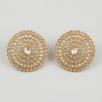 Golden Noor Disc Earrings large gold-tone circular crystal stud earrings on gray background