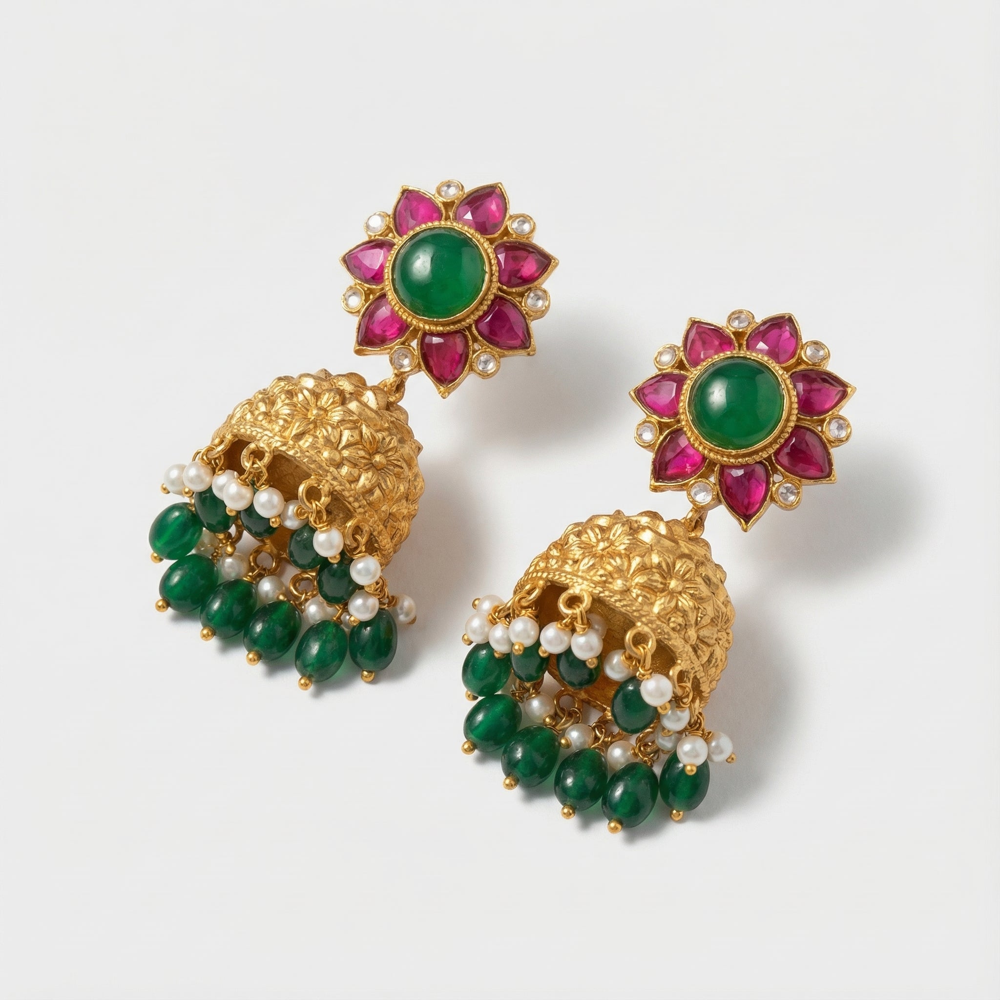 Gulnaar Emerald Dome Jhumkas detail showing embossed dome and colored stone floral top