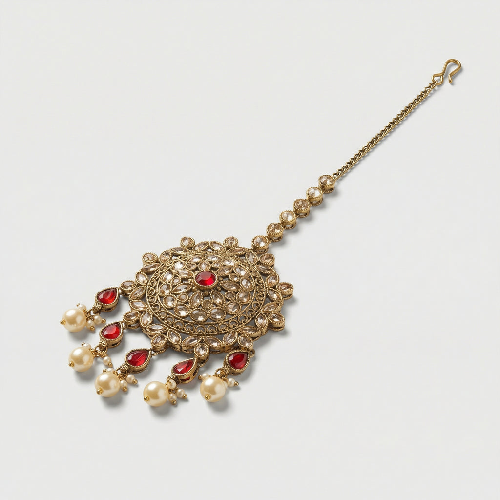 Noor Mahal Ruby Tikka detail showing filigree ruby medallion and teardrop fringe