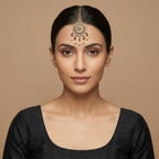 Noor Mahal Ruby Tikka detail showing filigree ruby medallion and teardrop fringe