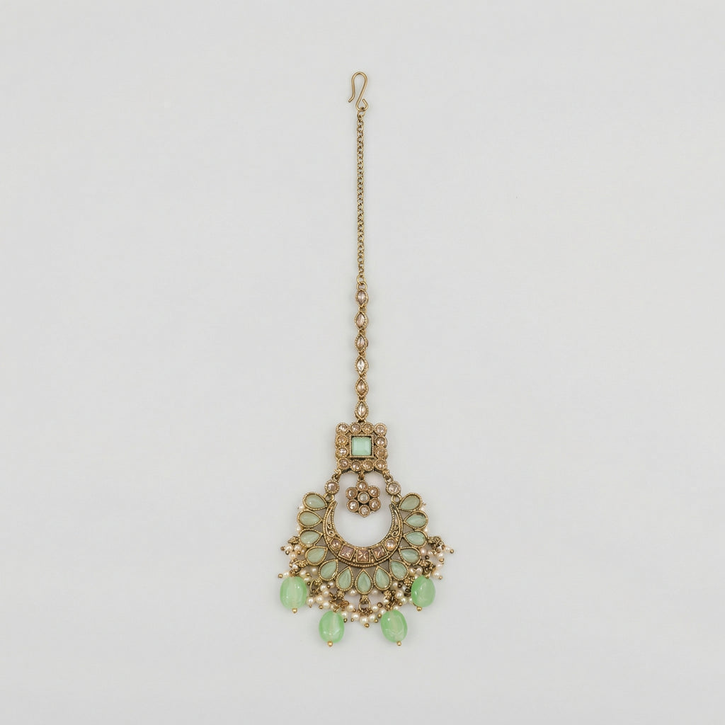 Mint Pearl Drop Tikka antique gold chaandbali maang tikka with mint stones and pearl fringe on gray background