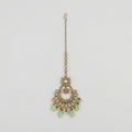 Mint Pearl Drop Tikka antique gold chaandbali maang tikka with mint stones and pearl fringe on gray background