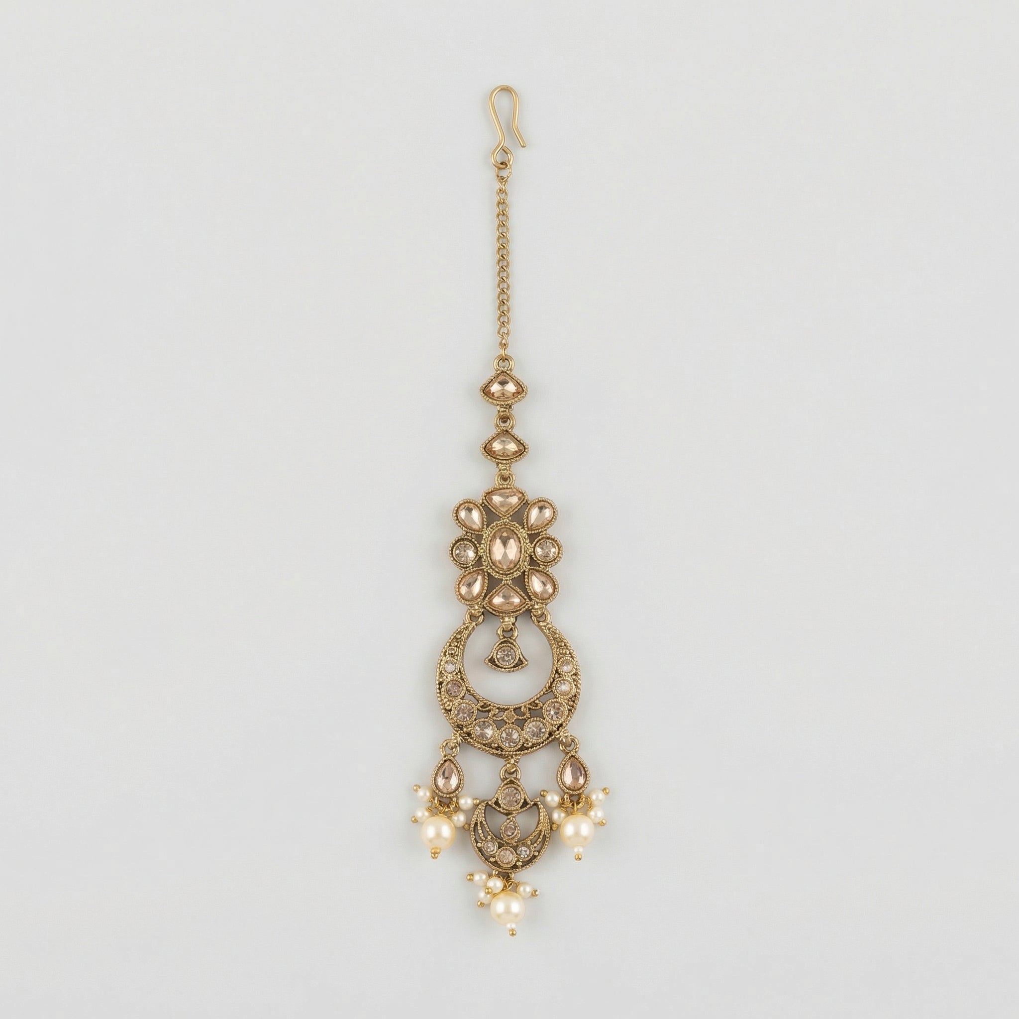 Ivory Aura Kundan Tikka antique gold chandbali maang tikka with kundan crescent and pearl drops on gray background