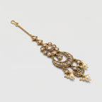 Ivory Aura Kundan Tikka detail showing floral kundan cluster, ornate crescent, and pearl-tipped drops