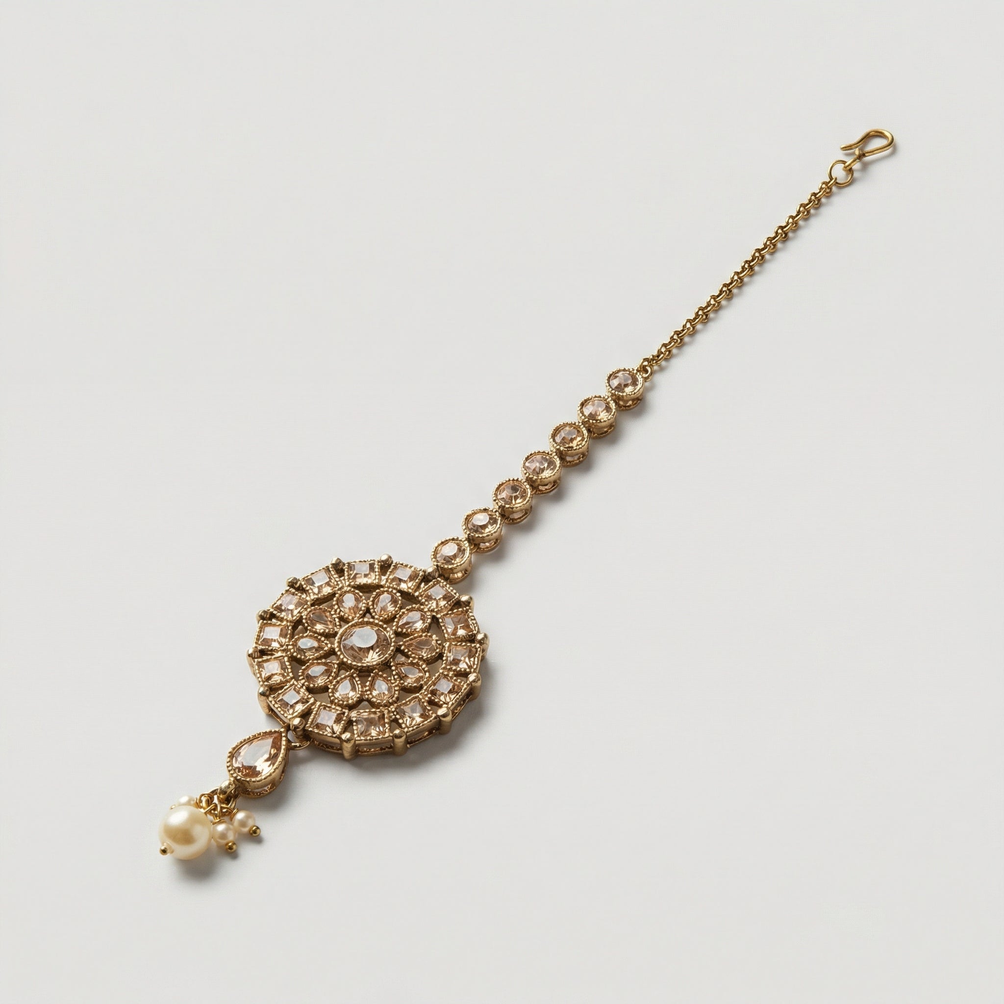 Classic Noor Round Tikka detail showing crystal link chain, floral medallion, and pearl-accent teardrop drop