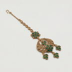 Verdant Glow Kundan Tikka detail showing green floral link, pavé crescent, and triple-leaf charms