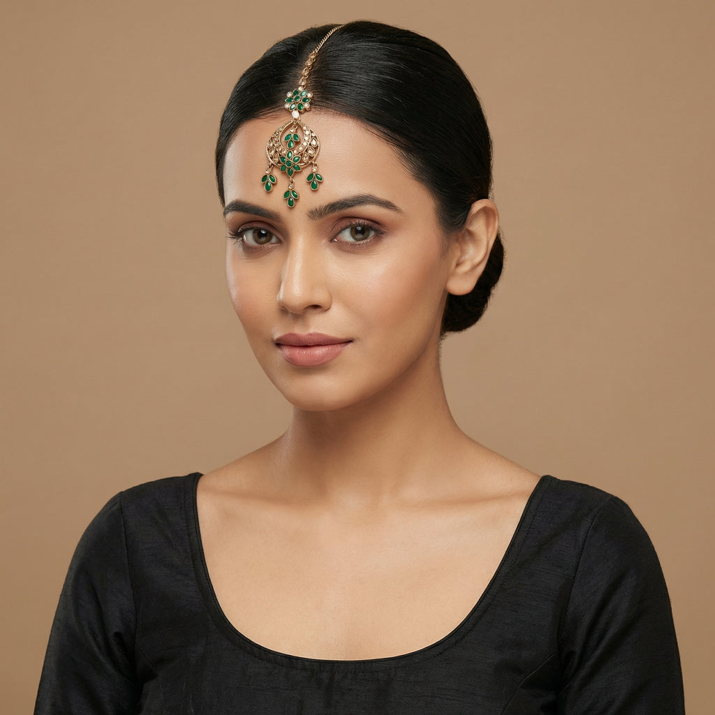 Verdant Glow Kundan Tikka detail showing green floral link, pavé crescent, and triple-leaf charms