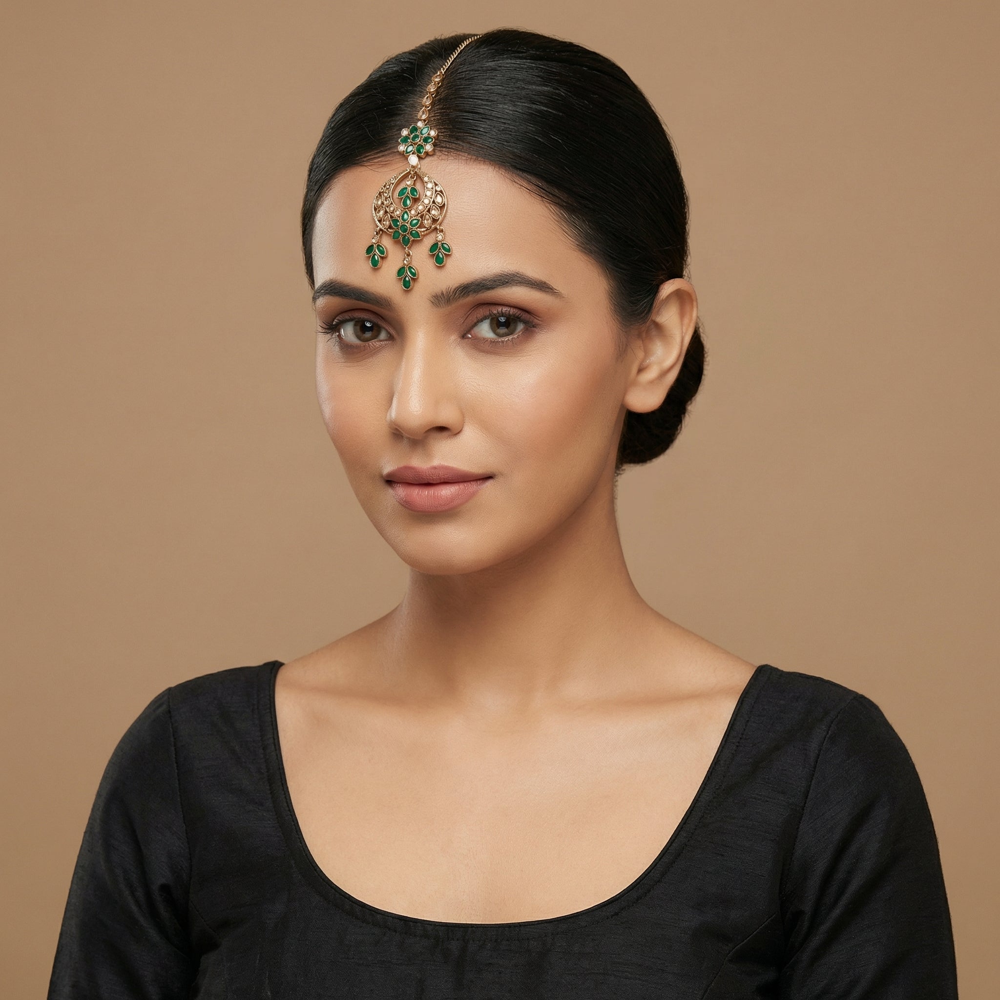 Verdant Glow Kundan Tikka detail showing green floral link, pavé crescent, and triple-leaf charms