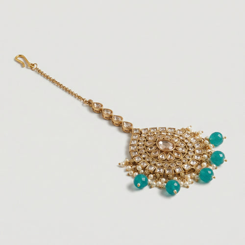 Aqua Chandni Kundan Tikka gold-tone fan pendant maang tikka with teal drops and pearls on gray background