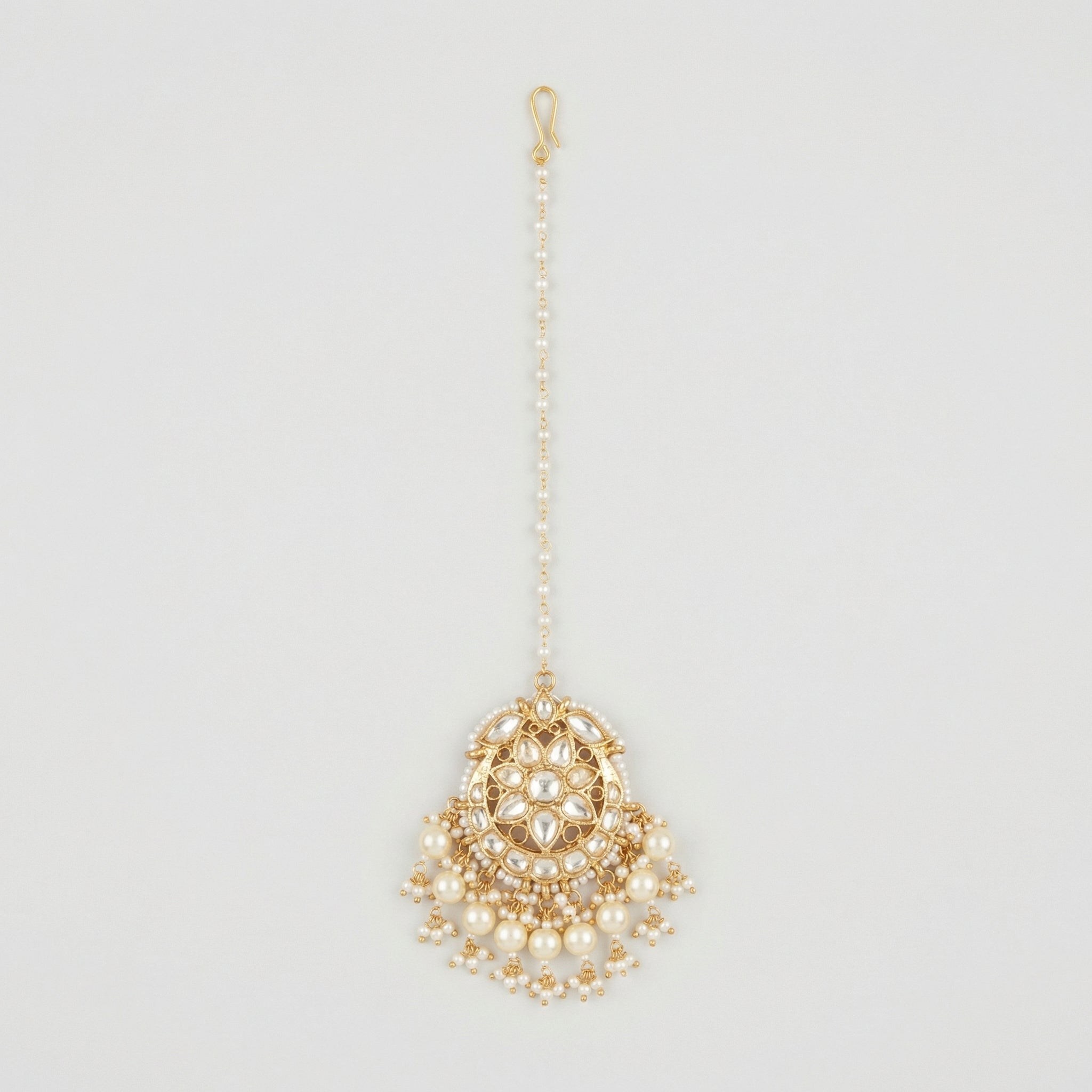 Luna Pearl Kundan Tikka gold maang tikka with pearl chain and kundan floral pendant on gray background