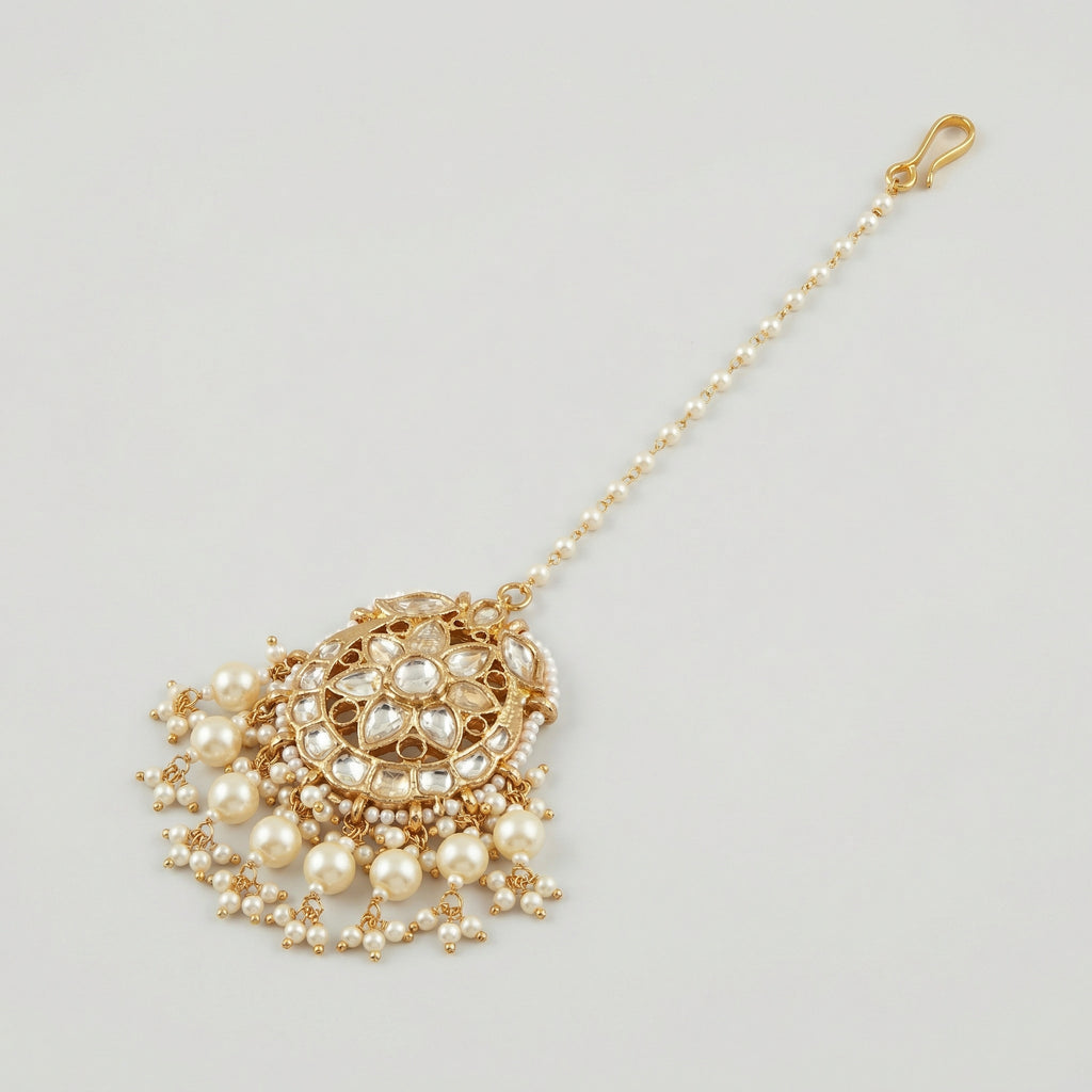 Luna Pearl Kundan Tikka detail showing pearl strand, clear stone floral center, and pearl drop fringe