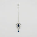 Sapphire Drop Crystal Tikka silver maang tikka with navy blue center stone on gray background