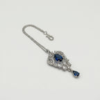 Sapphire Drop Crystal Tikka detail showing oval navy center, clear pavé frame, and navy teardrop drop