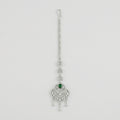 Emerald Grace Tikka silver-tone maang tikka with emerald-green pear center and clear stone frame on gray background