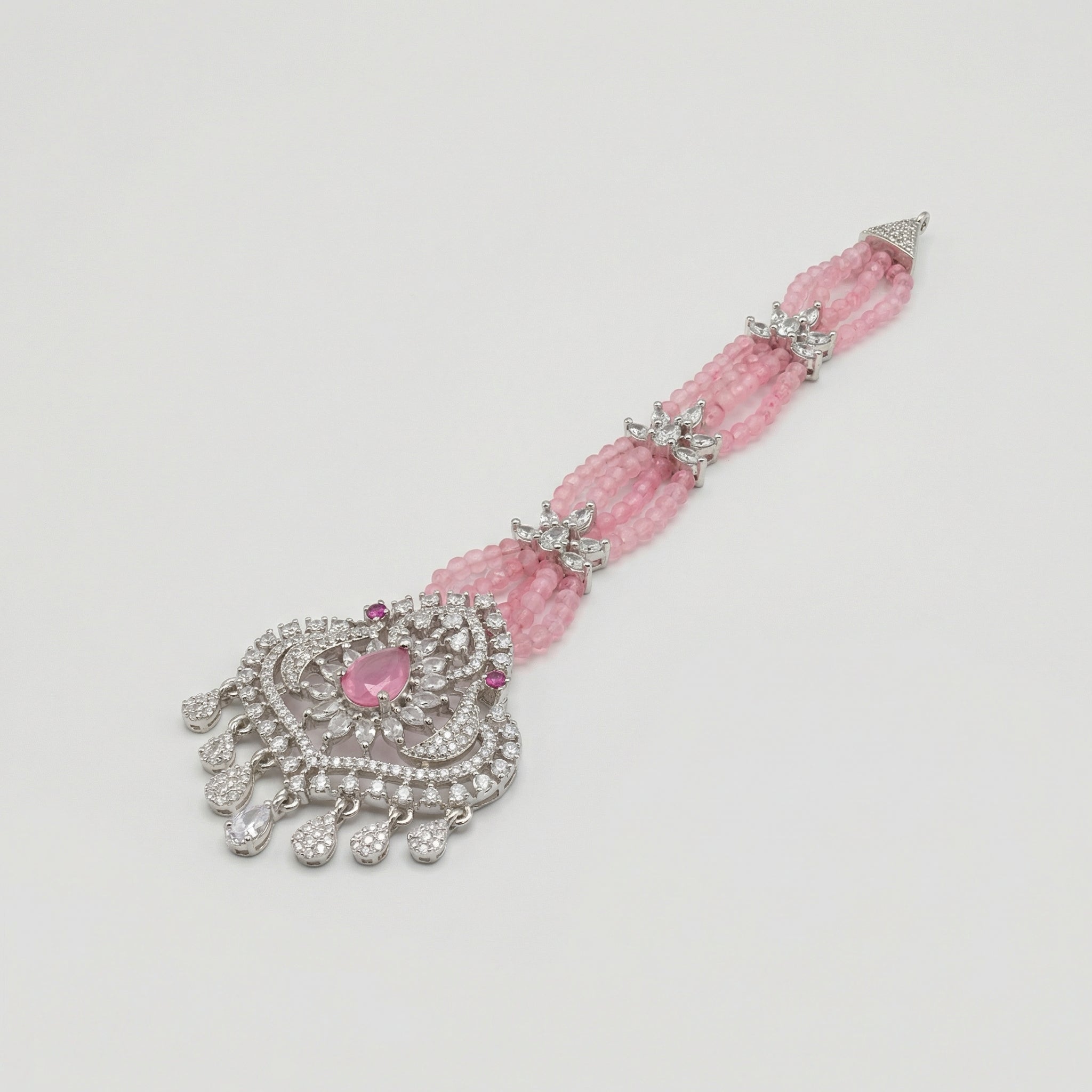 Rose Heirloom Tikka detail showing pink bead rows and teardrop crystal charm fringe