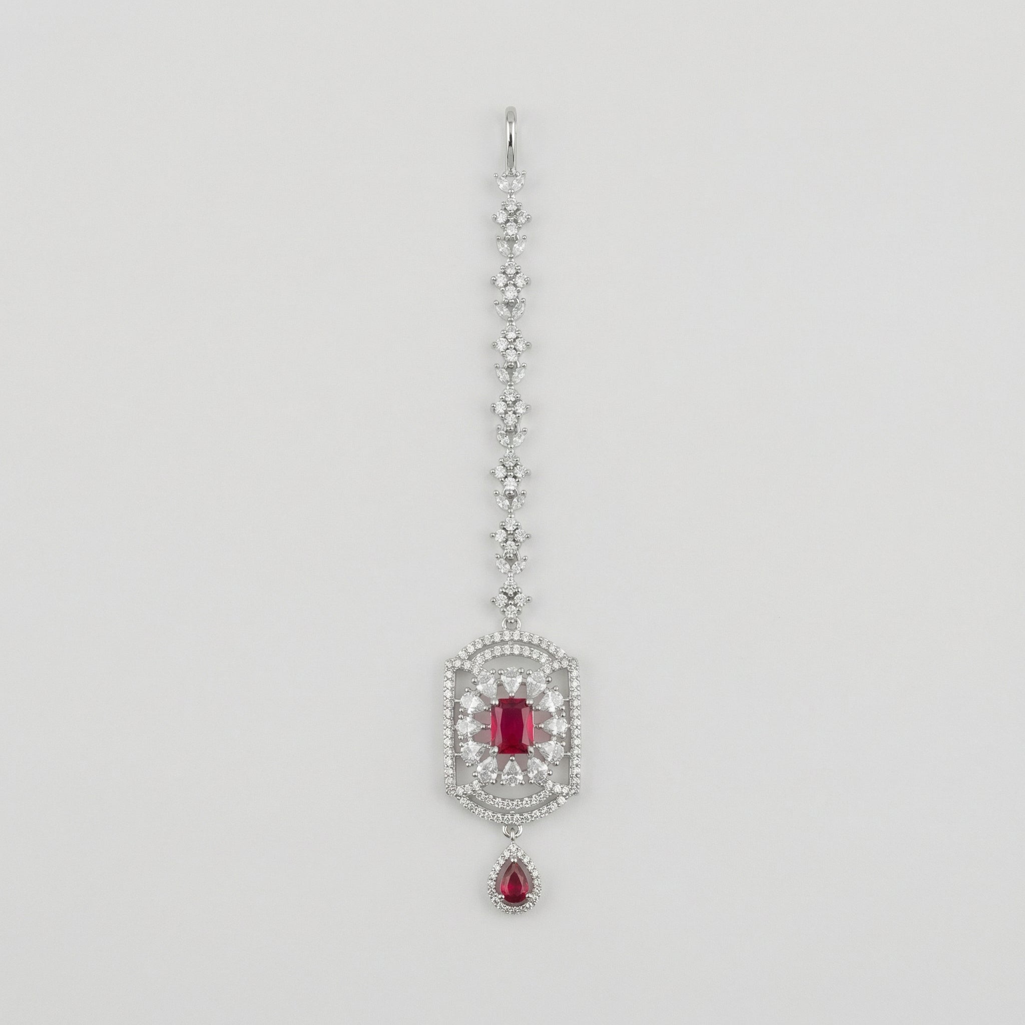 Rani Ruby Tikka silver maang tikka with ruby-red rectangular center stone on gray background
