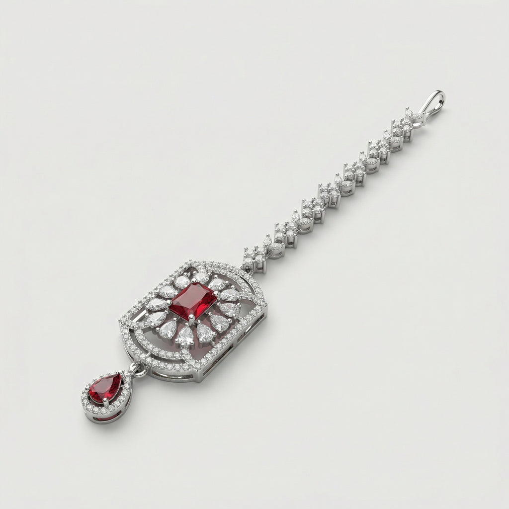 Rani Ruby Tikka detail showing floral crystal chain, ruby center, and ruby teardrop drop