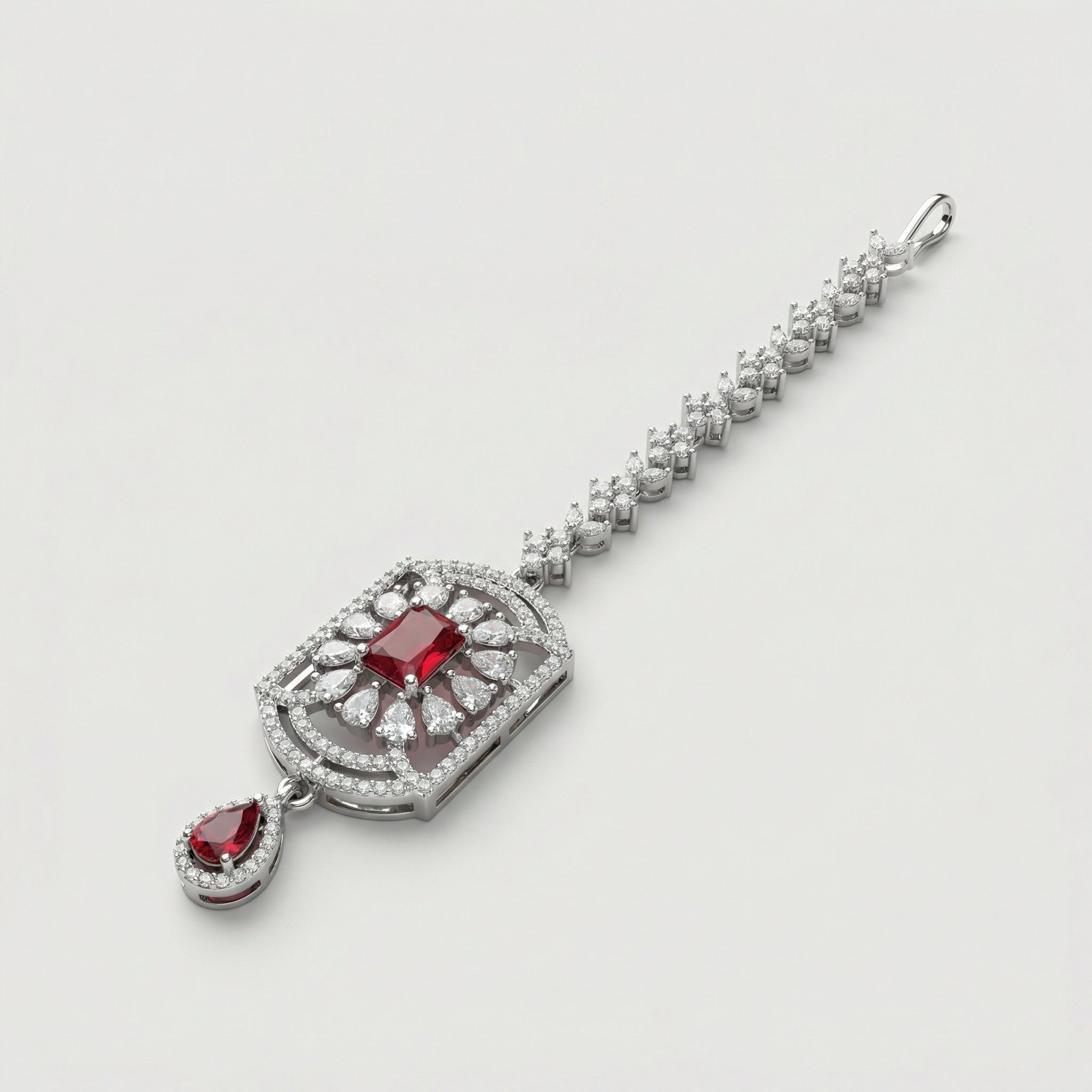 Rani Ruby Tikka detail showing floral crystal chain, ruby center, and ruby teardrop drop
