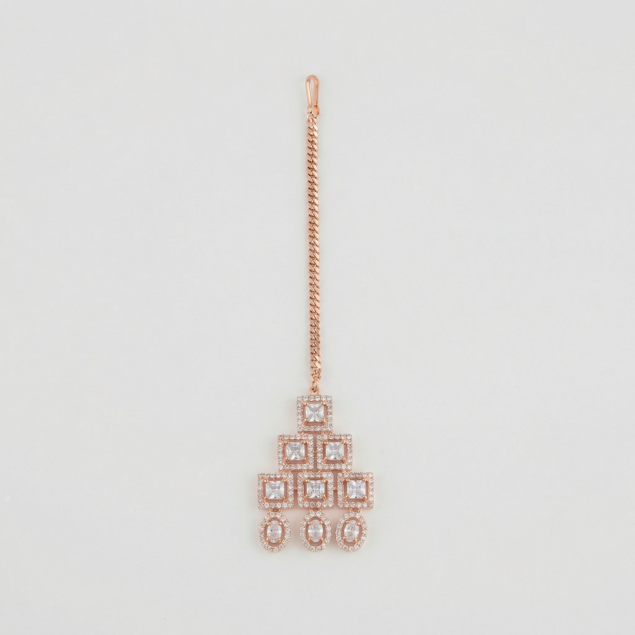 Rosette Frame Drop Tikka rose gold maang tikka with tiered square crystal frames on gray background