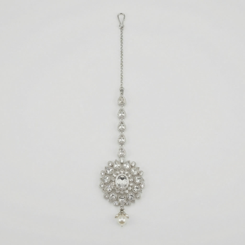 Silver Flora Pearl Tikka silver maang tikka with floral crystal pendant and pearl drop on gray background