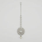 Silver Flora Pearl Tikka silver maang tikka with floral crystal pendant and pearl drop on gray background