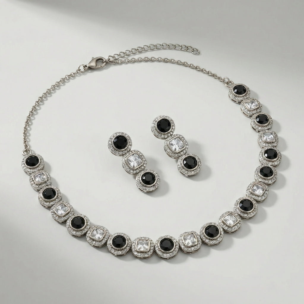 Zehra Onyx Halo Necklace Set necklace detail with black halo accents and matching earrings, flatlay