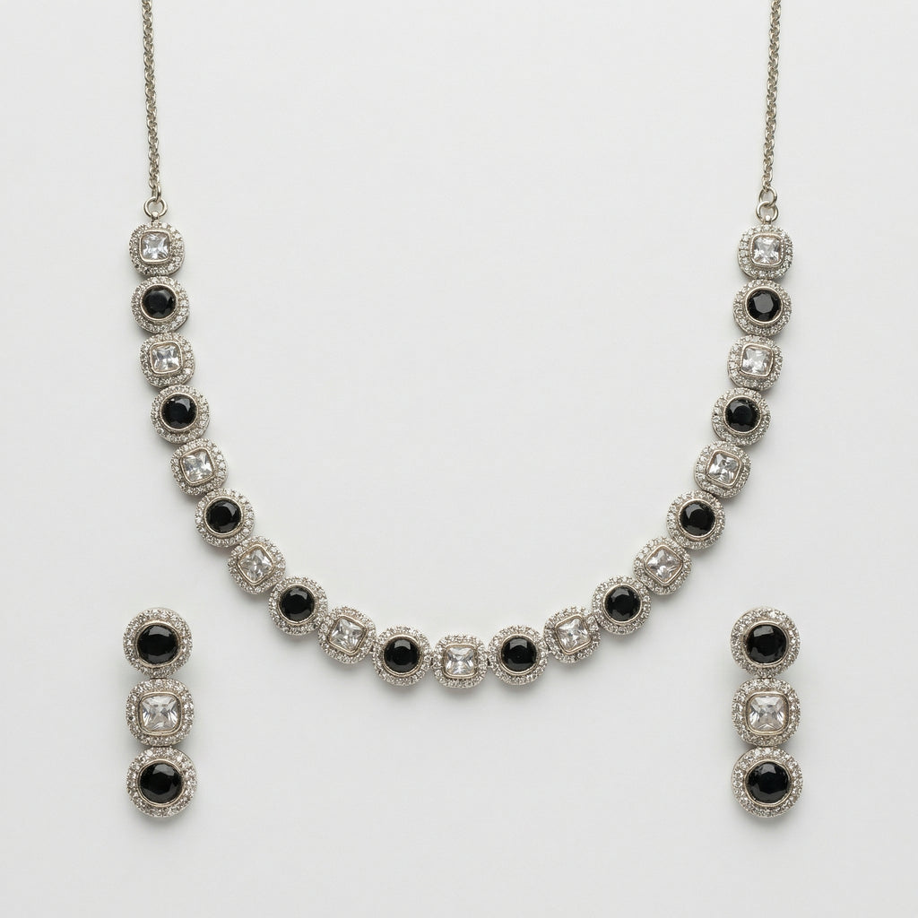 Zehra Onyx Halo Necklace Set necklace with matching earrings, studio flatlay