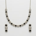 Zehra Onyx Halo Necklace Set necklace with matching earrings, studio flatlay